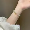 Pulsera de la suerte de perlas ultrafinas para mujer estilo Ins pulsera de lujo ligero nicho alta gama pulsera de Hetian Yu regalo al por mayor