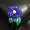 Broche de cristal azul y rojo con forma de rosa de alta gama, lujo europeo y americano, elegante, único y estiloso para mujer