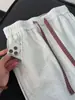 Pantalones de chándal plisados de color block retro americano para hombre, con diseño de patchwork a cuadros, corte holgado de pierna recta y estilo casual deportivo, perfectos para el otoño