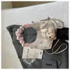 Bolsa Feminina de Design de Nicho 2026 Nova Moda de Bolinhas Bolsa de Axila Estilo Hong Kong Elegante Grande Capacidade Bolsa de Ombro Transversal