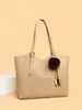 Bolso de mujer retro de color liso muy vendido, modelo nuevo 2026, bolso de hombro de alta gama, bolso tote de gran capacidad, bolso de moda para el día a día