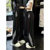 Pantalones deportivos de pierna recta a bloques de color a rayas estilo americano en azul marino para hombre, adecuados para primavera y otoño, marca moderna versátil casual, pantalones casuales de pierna ancha holgados