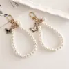 Creativo Elegante Nuevo Colgante de Mariposa de Perla Artificial DIY Llavero de Equipaje Colgante Cámara CCD Correa para Teléfono Móvil Oreja