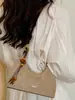 Bolsa de ombro casual, de alta qualidade, estilo coreano, uma bolsa de ombro nichada e estilosa para o dia a dia, apresentando cor sólida, design retrô e um estiloso formato crossbody.
