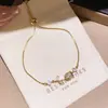 Pulsera de tulipán de circón con diseño de nicho de lujo ligero, pulsera floral simple estilo bosque, joyería versátil de alta gama para mujer