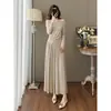 Conjunto de Malha Off-Shoulder Irregular com Botões, Cintura Elástica e Saia Ampla de Comprimento Longo Estilo Pura Vontade para 2026