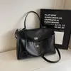2026 Primavera Novo Estilo Europeu e Americano Simples Grande Capacidade Casual Fivela de Cadeado Bolsa Grande Ombro Único Moda Tendência Bolsa Transversal Bolsa Feminina