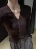 Cárdigan de punto negro estilo francés con cuello en V de un solo botón, suéter base suave de punto ajustado para mujer de principios de otoño