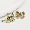 Pendientes de Aro con Lazo Europeos y Americanos Transfronterizos Nicho de Gama Alta Diseño con Galvanoplastia de Oro de 14K Pendientes Versátiles Pendientes al por Mayor