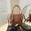 Bolso Cubo de Diseño Nicho Estilo Coreano Transfronterizo para Mujer 2026 Nuevo Verano Bolso de Hombro Cruzado Casual Simple