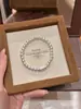 Pulseira Lua Branca Qian Duoduo para Riqueza, Joia de Contas de Design Nicho de Luxo Leve para Mulheres