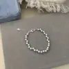 Elegante Estilo Nuevo Perfectamente Redondo Tres-Siete-Agujeros Moda Exquisita Pulsera de Perlas Rosa Manta, Joyería de Diseño Versátil de Lujo Ligero