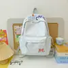Mochila al por mayor estilo coreano estilo universitario versátil para ir al trabajo y a la escuela para mujer alta apariencia gran capacidad mochila casual escolar