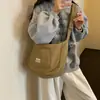 Bolso acolchado de color liso estilo coreano para mujer 2026 Otoño/Invierno Nuevo Tejido de nailon Gran capacidad Ligero para ir al trabajo Bolso de hombro único Cruzado para mujer