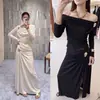 [Destacado] Yuran 26 Nueva Colección de Principios de Otoño: Conjunto de punto con hombro asimétrico y manga larga, mezcla de acetato, con falda midi de abertura lateral