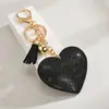 Nuevo Llavero de Corazón de Celebridad de Internet de Moda Colgante de Cuero Llavero de Terciopelo Coreano con Pedrería Regalo de Corazón para Enamorados Venta al por Mayor
