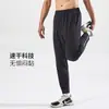 Calça de Corrida Masculina com Três Bolsos, Zíper na Cintura Traseira, Compartimento para Celular, Caimento Solto, Estilo Jogger, Calça Reta Tecida para Treinamento Fitness