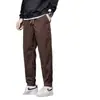 Pantalones jogger de pana forrados y engrosados de venta caliente transfronterizos para hombre, pantalones holgados y versátiles, pantalones cálidos de marca de moda para otoño e invierno