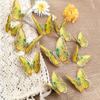 Una variedad de nuevas y creativas pegatinas de pared de mariposas doradas tridimensionales 3D, 12 pegatinas de pared decorativas autoadhesivas para sala de estar instaladas