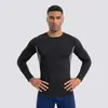 Camiseta deportiva de compresión negra de secado rápido y transpirable para hombre, manga larga, ropa de fitness, personalizada de fábrica, para exportación
