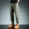 Colección de primavera y otoño transfronteriza: pantalones de trabajo modernos para hombre, largo cropped, versátiles y de corte holgado, con puños elásticos, estilo casual