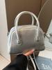 Bolsa pequena de textura de alta qualidade para mulheres, primavera e verão 2025, nova bolsa transversal multifuncional, casual, estilo coreano, bolsa portátil com travesseiro
