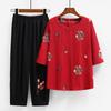 Verano nuevo para mujeres de mediana edad y mayores de talla grande, traje de camiseta de manga tres cuartos bordada estilo étnico, top estilo occidental para mamá