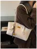Bolso de axila de nicho vintage de alta gama para mujer 2026 Nuevo Otoño/Invierno Simple de gran capacidad Versátil de un solo hombro Bolso para mujer