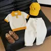 Ropa Infantil Estilo Coreano 2026 Verano Nuevo Elegante Bloques de Color Calado Tejido Transpirable Camisa Polo Pantalones Casuales de Pierna Recta