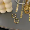 Pendientes transfronterizos de acero inoxidable Europa y Estados Unidos Pendientes Mobius Pendientes de torsión chapados en oro de 18k Pendientes de sensación高级 al por mayor