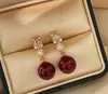 Zhengyuan Shijia Perla Diana Longitud Media Diamante Brillante Aguja Plateada Seiko Aretes Elegantes de Gama Alta Moda Año Nuevo