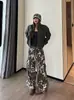 Pantalones de camuflaje patchwork de estilo americano transfronterizo con letras y estrellas, de corte holgado unisex de moda, de pierna ancha curvada de alta costura, pantalones vaqueros casuales
