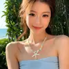 Versátil collar de alta gama estilo vacacional para mujer, diseño moderno y de lujo ligero, cadena para suéter, cadena para clavícula de estrella de mar estilo coreano, cadena para el cuello