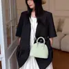 Bolsa con Carcasa de Piel de Oveja 2026 Nueva de Nicho de Gama Alta para Bolos Bolso de Mano de Cuero Genuino Mini Bolso Cruzado de Hombro para Mujer