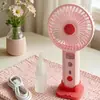 Ventilador de mano nuevo, simple y elegante, con rociador hidratante y tres velocidades de viento, que cuenta con una base de carga directa para teléfono, perfecto como ventilador de escritorio y como regalo