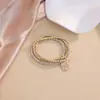 Pulsera de Hebilla de Herradura con Cuentas Doradas Apiladas para Mujer Diseño Ins Pulsera de Corazón Estrella Candado Tendencia Suministro Transfronterizo