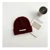 Gorro de lana tejido para niños coreanos de otoño e invierno cálido simple moda Joker moda Joker estilo extranjero gorro de lana al por mayor