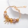 Pulsera con atrapasueños dorado Panjia transfronterizo europeo y americano, nueva, versátil, pulsera de cuentas con agujero grande de cristal de lujo, venta al por mayor
