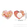 Suministrado directamente por el fabricante, los dijes para zuecos con forma de corazón de arena movediza más vendidos, hebillas creativas para zapatos DIY, accesorios para zuecos
