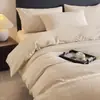 Lujo ligero de alta gama simple moderno todo algodón algodón puro jacquard juego de cuatro piezas funda nórdica de alta calidad juego de tres piezas para cama de dormitorio de estudiante