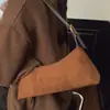 Bolso de moda de nicho tipo baguette para axila para mujer 2025 Nuevo Retro Textura esmerilada Bolso de mano para hombro Bolso cruzado pequeño