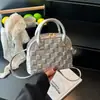 Bolsa Feminina Textura Moderna Comércio Exterior 2026 Nova Xadrez Concha Versátil Ombro Único Sobrancelha Bolsa de Mão para Senhoras