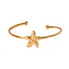 Pulsera de Acero Inoxidable con Forma de Estrella de Mar Estilo Europeo y Americano Serie Marina de Gama Alta Chapado en Oro de 18K Circonita Apertura Pulsera Exquisita