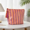 Bolsa de maquillaje impermeable de PVC, nuevo modelo transfronterizo para mujer, neceser rayado de gran capacidad, bolsa de almacenamiento de viaje versátil, fábrica