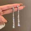 Pendientes largos elegantes con borlas de diamantes con destellos de Corea del Sur y aguja plateada transfronteriza, con personalidad de nicho que combinan con todo, con diseño avanzado para mujer