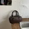 Bolso de textura tejida para mujer 2026 nuevo estilo moderno de verano tacto de alta gama bolso de mano tipo bola de boliche bolso cruzado de un solo hombro para el trabajo