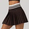 Nueva falda plisada de tenis de cintura alta para otoño e invierno para mujer, minifalda deportiva de bádminton con bolsillos, falda falsa de dos piezas anti-exposición