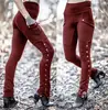 Pantalones lápiz sexy de diseño dividido con remaches para mujer europeos, pantalones lápiz elásticos de bolsillo decorativos