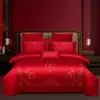 Juego de ropa de cama de lujo estilo chino, hecho de algodón 100% de fibra larga, un juego de cuatro piezas que incluye una sábana y una funda de edredón de algodón puro rojo, perfecto para la alcoba de una recién casada.