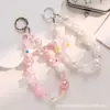 Nueva cadena para teléfono Barbie en negro y rosa, accesorio de teléfono dopamina dulce y picante, joyería de cadena con colgante de cuentas estilo ins